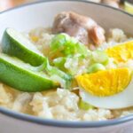 How Is Arroz Caldo, or Chicken Rice Porridge, Traditionally Prepared in the Philippines?