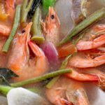 How Is the Sinigang (Sour Soup) Cooking Technique Used in Philippine Seafood Dishes?