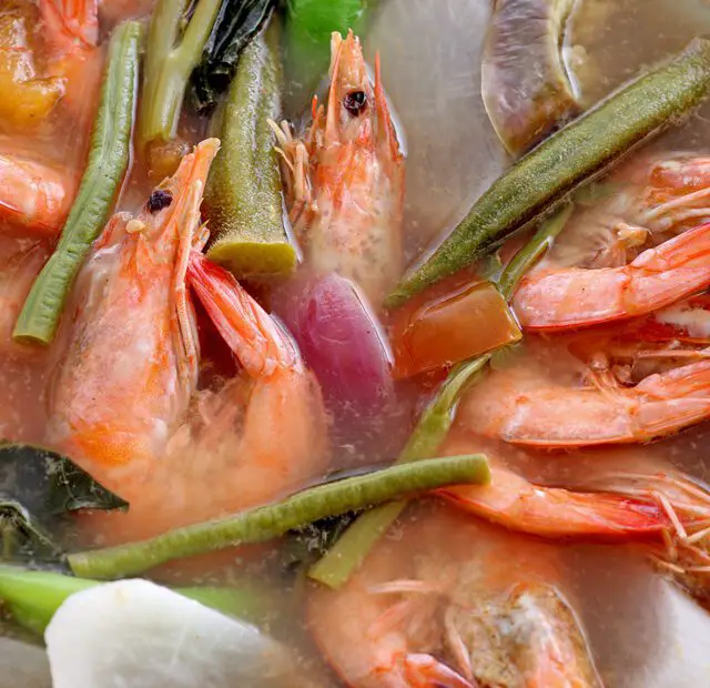 How Is the Sinigang (Sour Soup) Cooking Technique Used in Philippine Seafood Dishes?